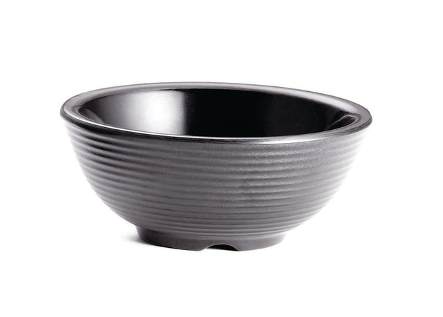 A black ceramic bowl with a glossy interior and matte, ribbed exterior sits on a white background. The simple, round shape resembles a large ramekin and features a small, slightly raised base. This bowl is also dishwasher safe for easy cleaning.