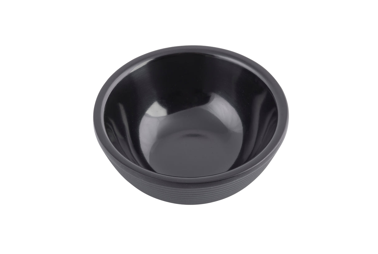 A small, empty black ramekin with smooth, glossy sides and a ribbed texture sits centered on a white background. The bowl features a simple, modern design and appears to be made of melamine or ceramic.