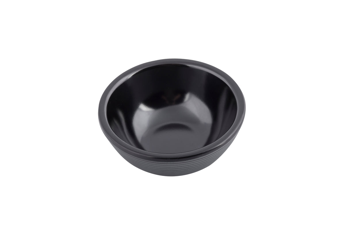 A small, round, black ceramic ramekin with a smooth, glossy interior and subtly textured exterior, shown on a white background. The bowl is empty and its simple, minimalist design is clearly visible.