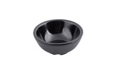 A small, empty, black ceramic ramekin with a glossy finish and horizontal ridges around the exterior sits on a white background.