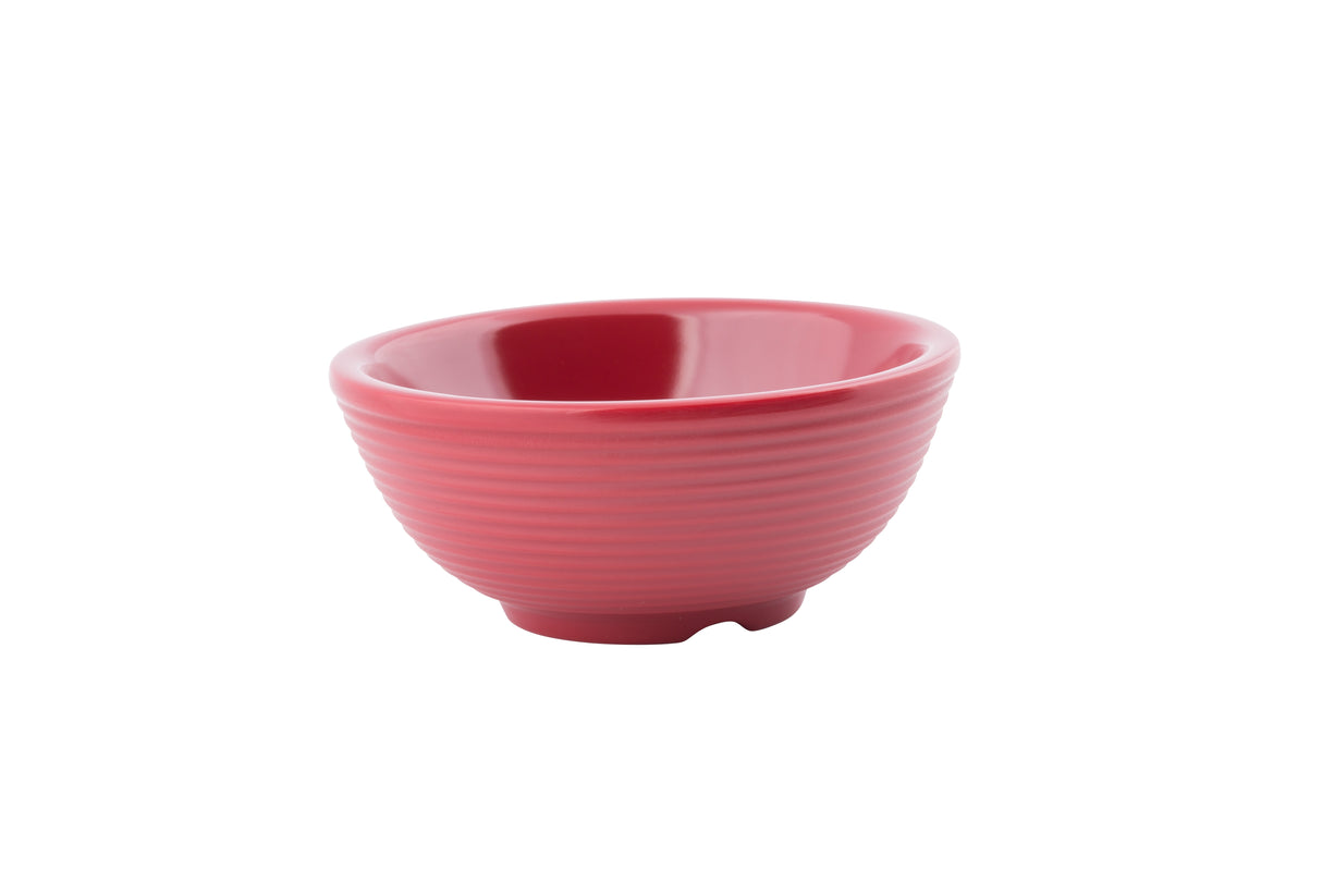 A small, round, pink ceramic ramekin with a ribbed exterior and a smooth, glossy interior, set against a plain white background. The bowl has a slightly flared rim and a short, stable base.