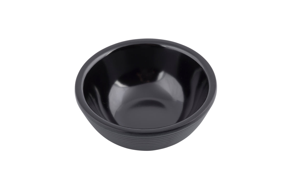 A small, empty, round black SaferFoods Solutions Ramekin with a smooth, glossy finish and subtle horizontal ridges on the outer surface, photographed on a white background. This melamine ramekin is both stylish and durable.