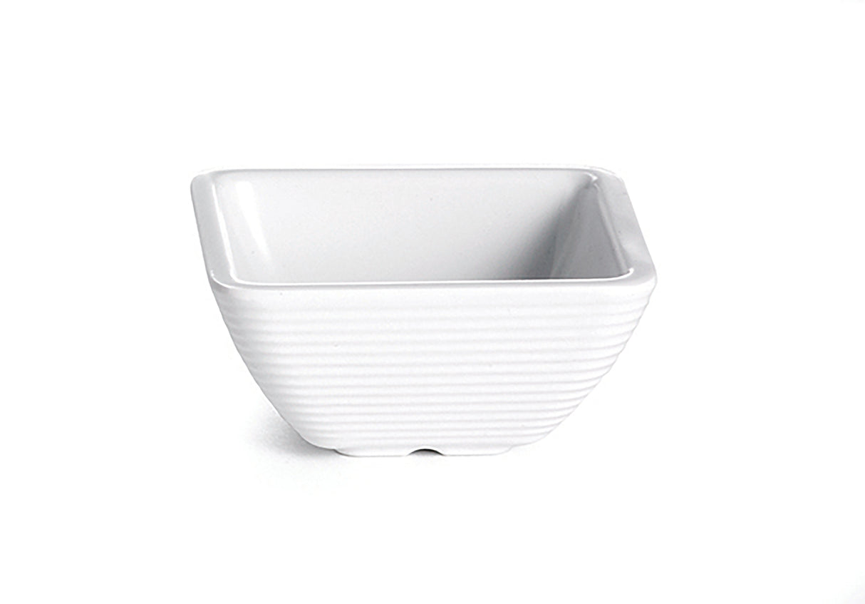 A small, empty, white ceramic ramekin with a square shape and gently rounded edges. The bowl features subtle horizontal ridges on its exterior and sits on a plain white background.