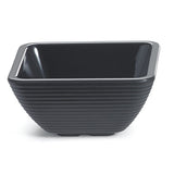 A black, square-shaped melamine bowl with gently rounded corners and horizontal ridges around the exterior. The bowl has a glossy finish inside, matte texture outside, sits on a small raised rectangular base, and is dishwasher safe.