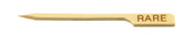 A light-colored bamboo Meat Marker Pick by TableCraft, angled to one side with a pointed tip and the word RARE burned into its flat end, commonly used to indicate a rare-cooked steak.