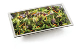 A rectangular stainless steel bowl filled with a mixed green salad, including leafy greens and thin orange carrot strips, set against a white background. Part of the Remington Collection Bowl series and conveniently dishwasher safe.