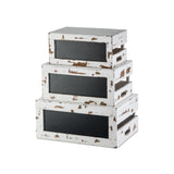 Three stacked, rectangular vintage-style distressed wood crates with black panels create a nesting crate set. Each Rustic Risers Crate Set box is slightly smaller than the one below it, forming a charming tiered effect on a plain white background.