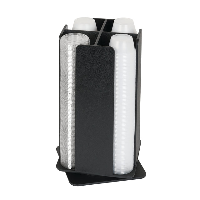 A black, four-compartment countertop organizer holds stacks of clear plastic cups. Two compartments contain clear cups, and two hold translucent cups. The Portion Cup and Lid Organizer is designed for easy dispensing on any flat surface.