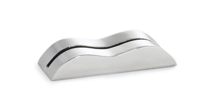 A sleek, metallic, wave-shaped card holder made of stainless steel with a reflective surface and a thin horizontal slot along its curved top, placed on a white background. The object has smooth edges and resembles a modern, minimalist desk accessory.