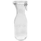 A clear glass carafe with a wide base, narrow neck, and a re-sealable hinged clamp-style lid. The bottle stands upright and isolated on a white background, showcasing its transparent texture and simple design.