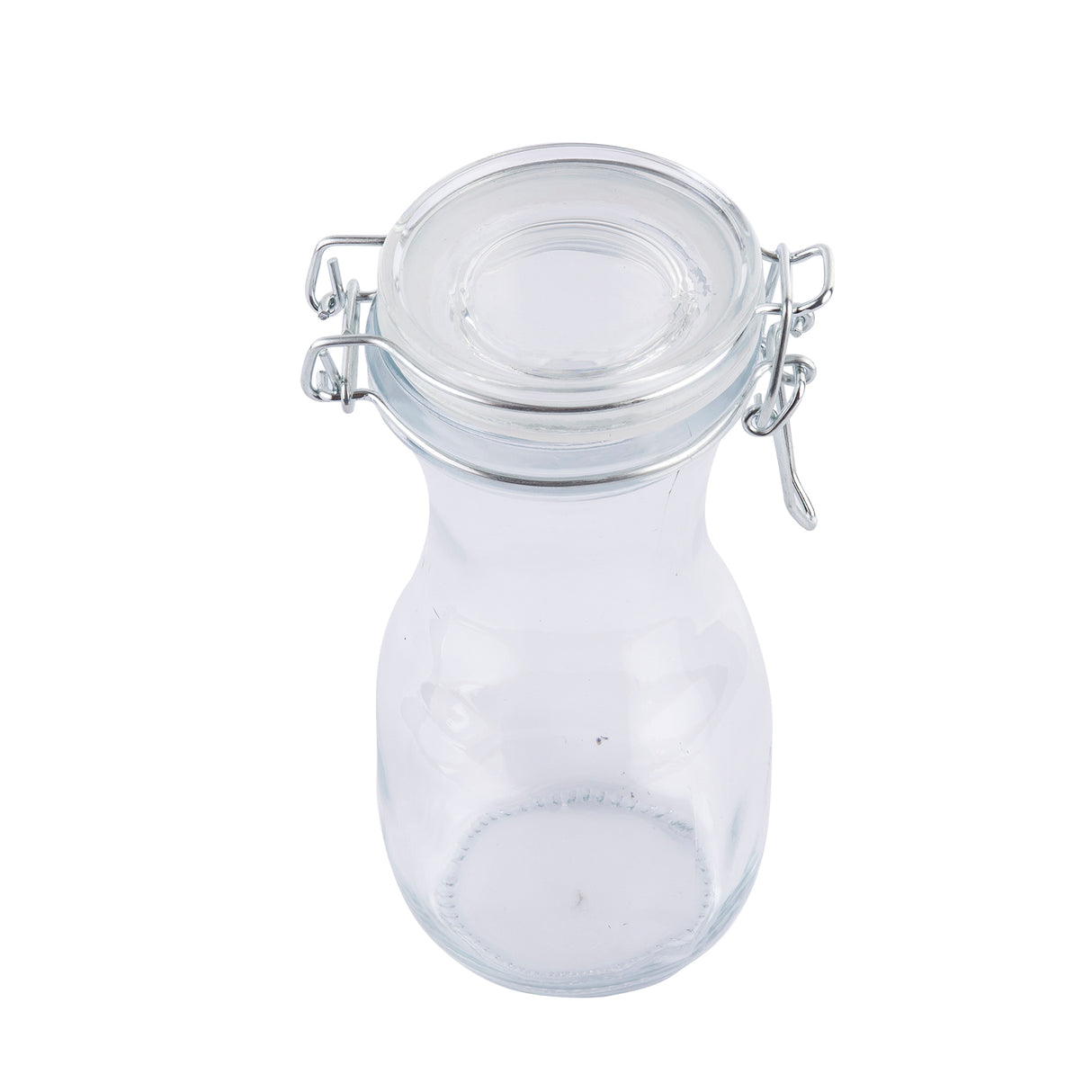 A clear, empty glass jar with a round body, wide neck, and a re-sealable glass lid secured by a metal wire clasp. The jar is pictured against a white background, highlighting its transparency and simple, functional design.