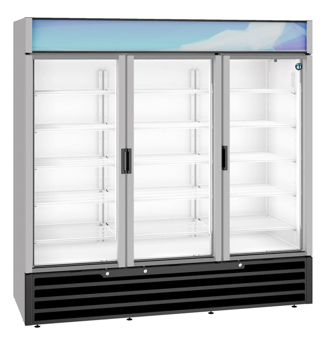A large glass door refrigerator with three doors, each with a black handle. The brightly lit, empty interior has multiple white wire shelves. This reach-in cooler features a black vented base and a blue-tinted panel at the top.