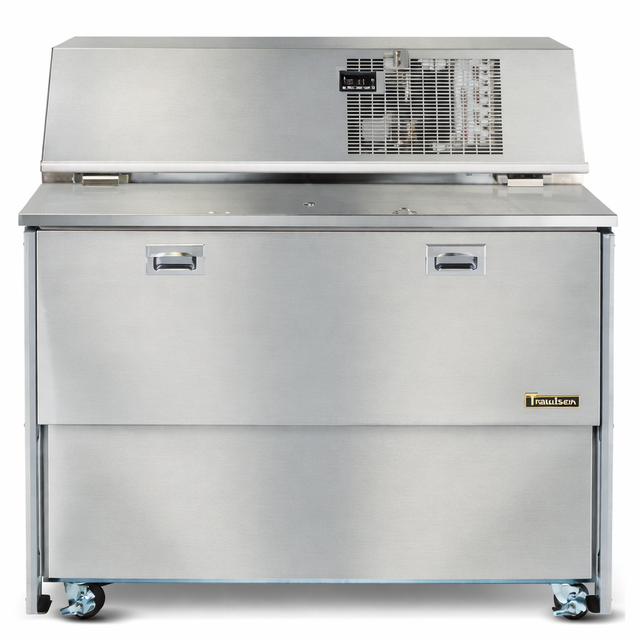 A large, stainless steel Traulsen commercial refrigerator on wheels with a top-mounted electronic control panel, two recessed handles on the front, and a label reading Traulsen near the bottom right corner—ideal for RMC49 Replacement or as a Milk Cooler Refrigeration System.