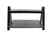 A two-tiered black metal rack from the TableCraft Products Frostone Collection, featuring two flat rectangular shelves supported by four angular legs, photographed against a plain white background. The riser set has slightly uneven surfaces.