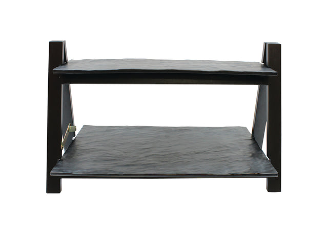 A two-tiered black metal rack from the TableCraft Products Frostone Collection, featuring two flat rectangular shelves supported by four angular legs, photographed against a plain white background. The riser set has slightly uneven surfaces.