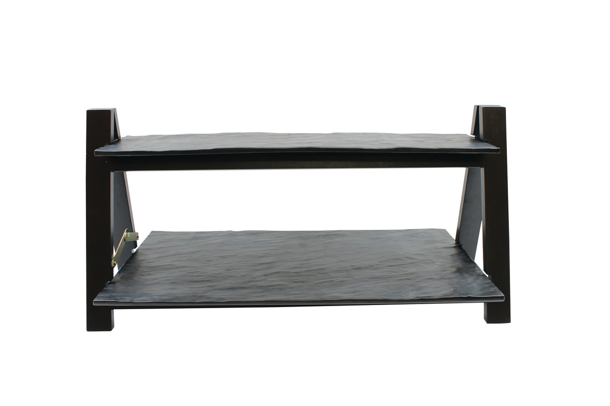 A two-tier folding riser from TableCraft Products, featuring black wooden shelves with flat, slightly textured surfaces and four sturdy legs. The parallel rectangular shelves have visible support bars on the sides and are photographed against a plain white background.