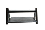 A two-tier folding riser from TableCraft Products, featuring black wooden shelves with flat, slightly textured surfaces and four sturdy legs. The parallel rectangular shelves have visible support bars on the sides and are photographed against a plain white background.