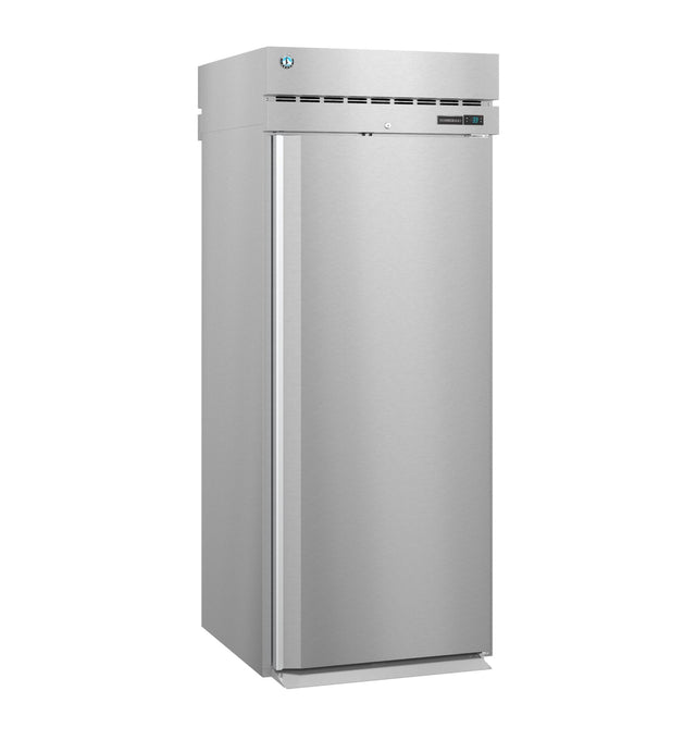 A tall, stainless steel Steelheart Series Refrigerator with a single solid door, top vent, and digital control display stands against a plain white background. The sleek roll-in refrigerator design is ideal for kitchens or food service environments.