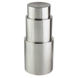 A stack of three brushed stainless steel containers forms a sleek, modern riser set with round, flat lids. Arranged from smallest to largest, the cylindrical tower features a matte metallic finish and smooth texture.