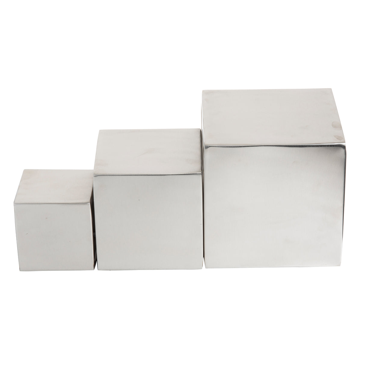 Three shiny brushed stainless steel cubes of increasing size are arranged in a row, touching each other side by side, from smallest on the left to largest on the right, against a plain white background—this is the Barclay Riser Set.