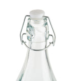A close-up of the top of a Prima Glass Bottle, 34 oz, featuring a re-sealable metal wire swing-top closure and a white ceramic stopper against a plain white background.