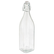 A clear, empty Prima Glass Bottle with a square base and a narrow neck, topped with a re-sealable metal swing-top closure and white cap. This 34 oz. bottle stands upright on a white background.
