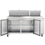 A commercial stainless steel Pizza Prep Table with two open top lids and double front doors revealing wire shelving inside. The unit features four wheels for mobility and a blue Empura Refrigeration logo on the bottom right corner.