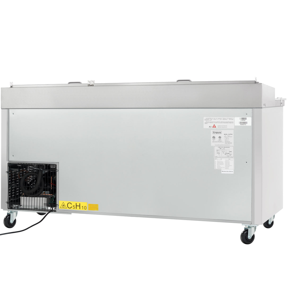 Large rectangular Empura Refrigeration commercial freezer shown from the back, with a vented compressor, stainless steel exterior, four wheels, two handles on top, and a power cord extending from the compressor housing. Warning labels are visible.