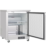 A commercial-grade Empura E-KUC27F undercounter reach-in freezer stands on four black wheels. Its door is open, revealing a white insulated interior with a wire shelf, vent at the back, and digital control panel below. The inner door has a dotted texture.