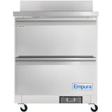A commercial stainless steel work top refrigerator on wheels with two horizontal doors, a digital temperature display, and Empura Refrigeration branding. This undercounter reach-in refrigerator features a clean, industrial design for professional kitchens.
