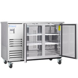 A commercial stainless steel cooler on wheels with two glass doors, both open to reveal three wire shelves inside. The left side has a control panel and vents, and the Empura brand label is displayed on the front—ideal as a back bar cooler.