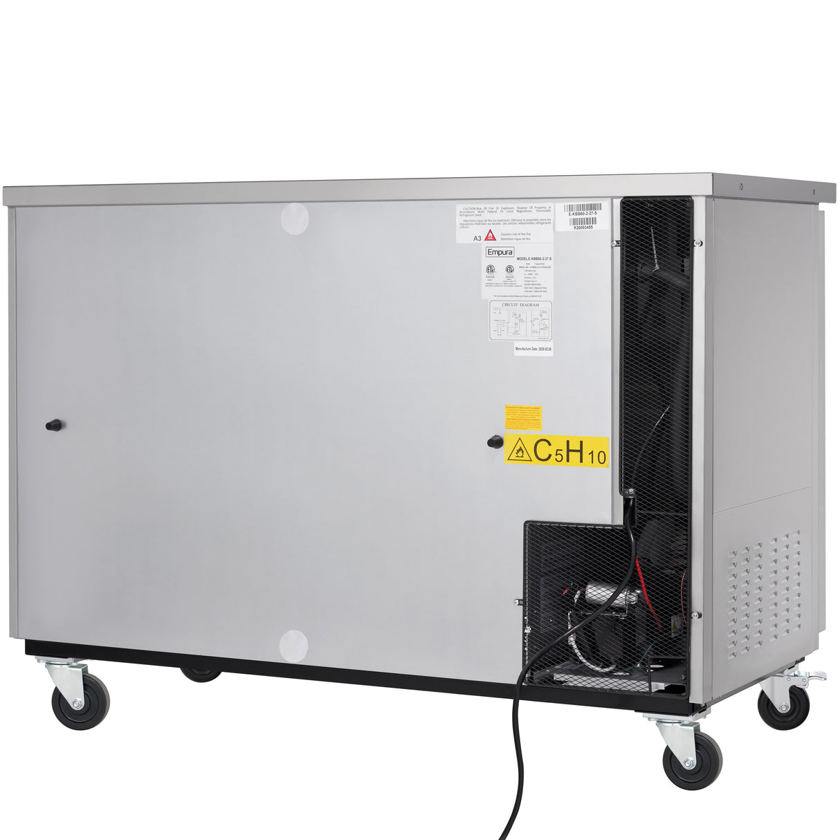A large, rectangular, stainless steel cooler on wheels with a warning label C5H10 on the vented side panel. The interior compartment is partly exposed, revealing wires and equipment inside. Various labels and instructions are visible on the front.