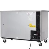 A large, rectangular, stainless steel cooler on wheels with a warning label C5H10 on the vented side panel. The interior compartment is partly exposed, revealing wires and equipment inside. Various labels and instructions are visible on the front.