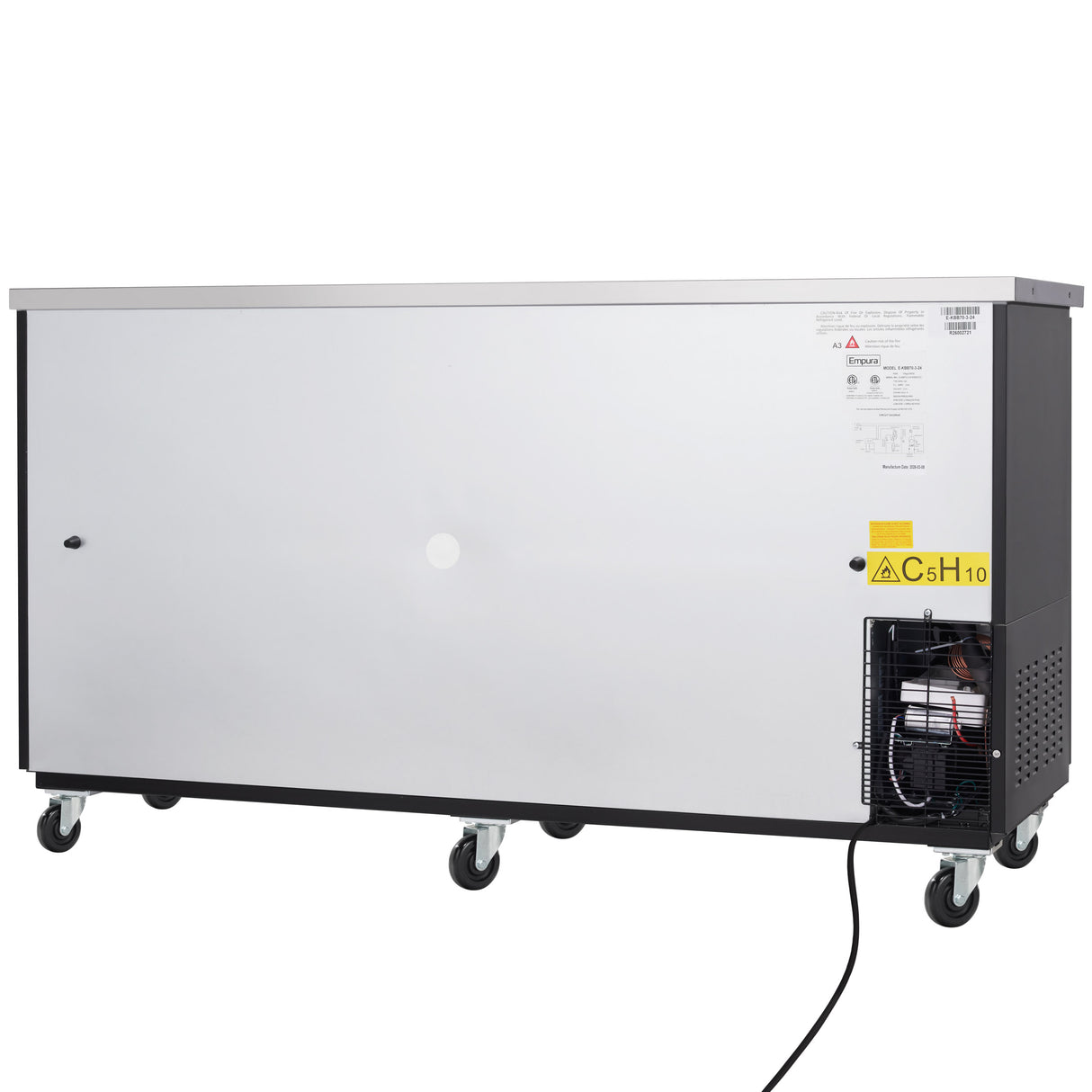 A large rectangular Empura Refrigeration unit with a stainless steel front panel, black trim, four caster wheels, and a visible motor and electrical cord on the lower right. Warning and information labels are affixed to the upper right corner.