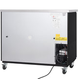 A large, silver and black Empura refrigeration appliance on four caster wheels. A ventilation grate and compressor are visible on the bottom right. Warning labels, including one with “C5H10,” and informational stickers are on the metal panel.