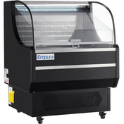 A black Empura refrigeration display with curved glass front and lit interior. This refrigerated display case has metal shelves, bottom vents, and wheels for mobility—ideal for showcasing chilled food or drinks in a store or cafe.