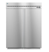 A large Steelheart Series Refrigerator stands upright, featuring a smooth, metallic stainless steel surface. Vents and a digital temperature display grace the upper front panel, while flush handles accent the closed double doors.