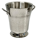 A shiny, silver Remington Collection stainless steel bucket with a hammered texture, two side handles, and a flared top sits on a round base. Its polished surface reflects light elegantly against the plain white background. Dishwasher safe for easy care.