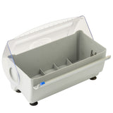 A rectangular, light gray plastic container with a clear hinged lid, side opening, and four inner compartments. Featuring a blue latch and black rubber feet, this Rapid Wrap Film Dispenser is designed for organizing small items. The lid is slightly propped open.
