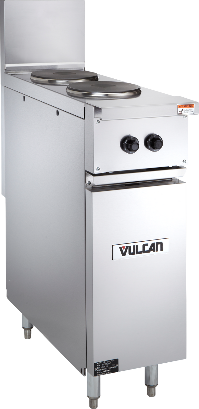 A stainless steel Vulcan commercial electric hot plate features two round French plates, two black control knobs, and a lower cabinet. The unit stands on four adjustable legs and has a caution label on the top right corner.