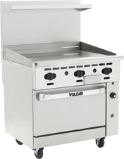 A commercial stainless steel restaurant range features four control knobs, a flat griddle top, and a spacious convection oven below with a Vulcan handle. It’s mounted on wheels with a raised backsplash and an upper shelf at the back.