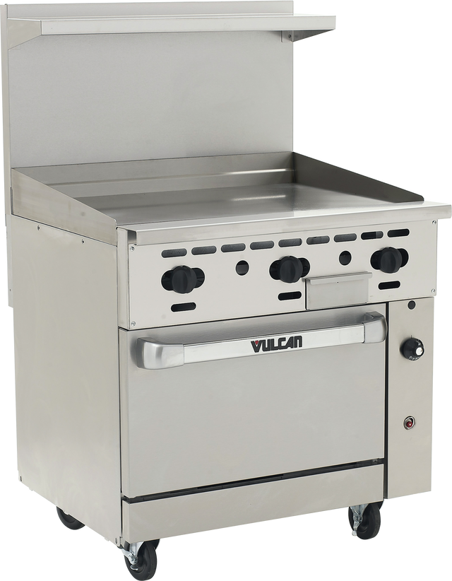 A commercial stainless steel restaurant range with four black control knobs, a flat griddle top, a convection oven below labeled “Vulcan,” a backsplash with a small shelf, and four caster wheels for mobility. The range features a clean, industrial design.