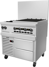 A large commercial stainless steel restaurant range with six control knobs, a wide flat cooking surface, high backsplash, storage drawers below, ventilation grates, and wheels for mobility. The Vulcan unit features digital controls on the lower left.
