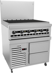 A commercial stainless steel restaurant range with six black burner knobs, a grated cooktop, refrigerated base with two drawers, ventilation slots, and a digital temperature display. The unit is on wheels and branded Vulcan.