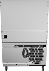 The image shows the back of a large, silver industrial appliance—possibly a restaurant range—with metal panels, a vented section, a power cord looped and stored externally, a small black rectangle (likely a power input), and two wheels at the bottom.
