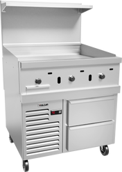 A stainless steel gas griddle commercial restaurant range features three knobs, a flat cooking surface, an overhead shelf, two lower drawers, a refrigerated base with digital display, and four casters for mobility—all set against a plain background.