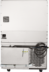 Rear view of a large silver commercial ice machine with a vented panel, black power cord, warning labels, and small caster wheels. Its industrial metallic surface pairs well alongside restaurant range equipment or a refrigerated base in any kitchen setup.