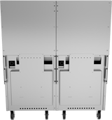 Rear view of a large, industrial metal restaurant range on wheels, featuring two main panels with ventilation slots, screws, and rectangular access doors. Two circular ports and black horizontal openings are visible near the top center of each panel.
