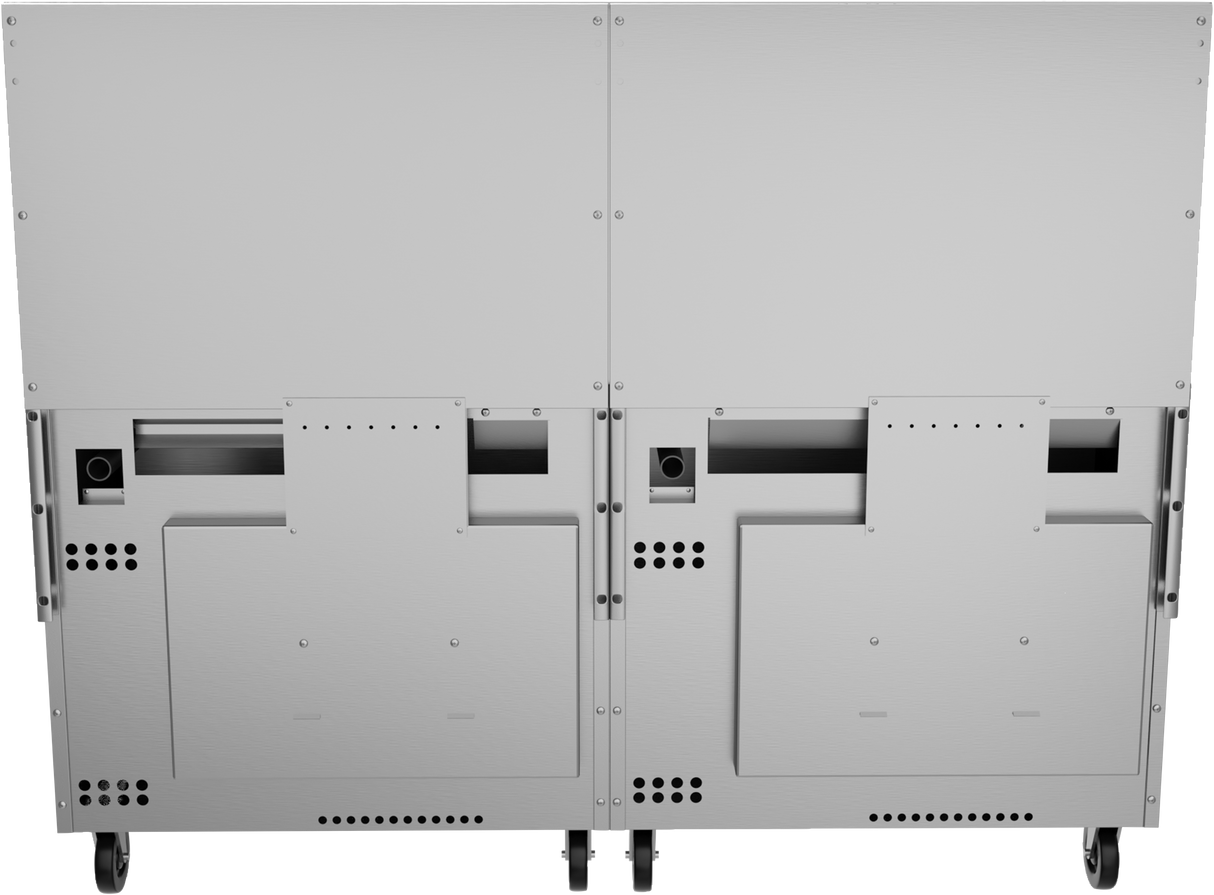The image shows the back view of two large, metallic, industrial equipment units placed side by side. Both resemble commercial appliances, such as a restaurant range or thermostatic griddle, each featuring access panels, ventilation holes, and black wheels for mobility.
