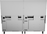 The image shows the back view of two large, metallic cabinets resembling a restaurant range, each with access panels, vents, wheels at the bottom, and various cutouts and mounting points. The surface is industrial and unadorned.